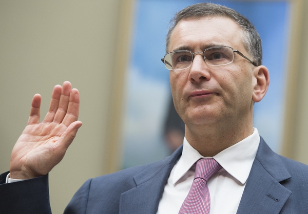 Jonathan Gruber, an economics professor at Massachusetts Institute of Technology (MIT) and a consultant on the drafting of the Affordable Care Act legislation known as "Obamacare," takes the oath prior to testifying during a US House Committee on Oversight and Government Reform hearing on Capitol Hill in Washington, DC, December 9, 2014. AFP PHOTO / SAUL LOEB        (Photo credit should read SAUL LOEB/AFP/Getty Images)