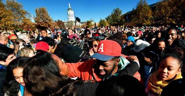 Student protesters on the campus of the University of Missouri in Columbia react to news of the resignation of University of Missouri system President Tim Wolfe on Monday, Nov. 9, 2015. Wolfe resigned under pressure from student protesters who claimed the president had not done enough to address recent racially-motivated incidents on the campus. (David Eulitt/Kansas City Star/TNS)