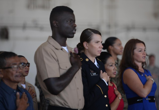 Service members, spouses, families receive U.S. citizenship on Andersen