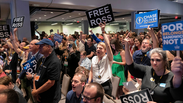 Libertarian delegates hold "Free Ross" signs as former President Donald Trump speaks at the Libertarian National Convention at the Washington Hilton in Washington, Saturday, May 25, 2024. AP Newsroom
